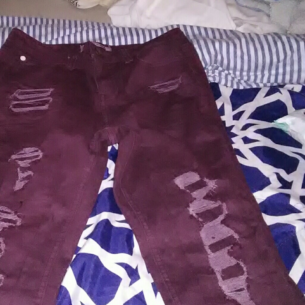Ripped burgundy jeans